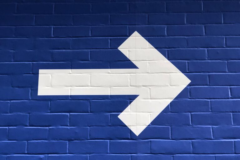Arrow showing people where to go on a wall